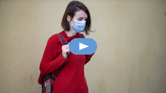 Are You Ready to Take off Your Mask? girl wearing a Covid mask outside carrying a backpack
