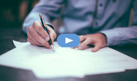 Channeling As A Healing Tool and Its Impact On Grief picture of a man writing on sheets of paper