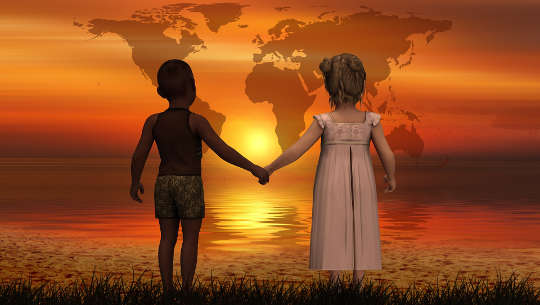 Teaching Children To Understand Others’ Perspectives a black child and a white child holding hands looking at a map of the Earth