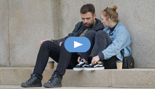 How to Build A Better Relationship Through Better Communication couple having a conversation sitting outside on steps