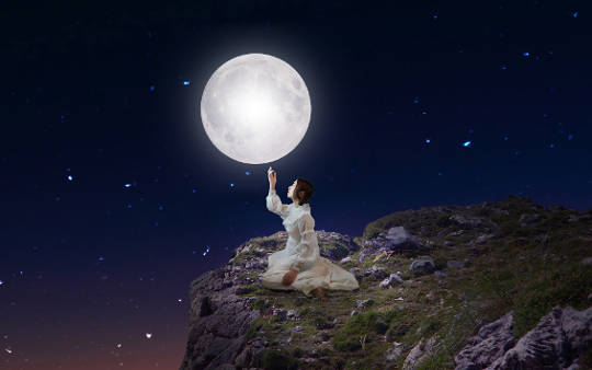 Moon Mysteries and Moon Ritual woman sitting under the full moon and stars