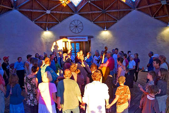 The Dances of Universal Peace: Unity in Heart and Breath a group dancing at a Dance of Universal Peace gathering
