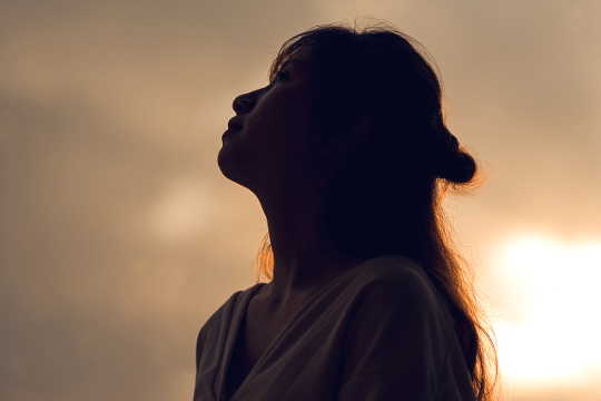 Healing Your Roots and Family Patterns woman looking up at the sky