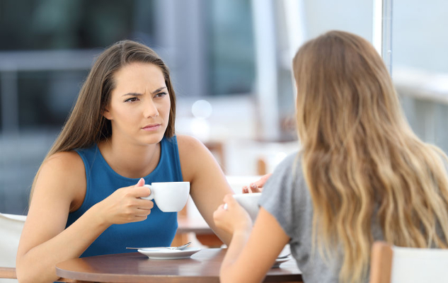 Why Do We Take Things Personally? two women facing each other having coffee