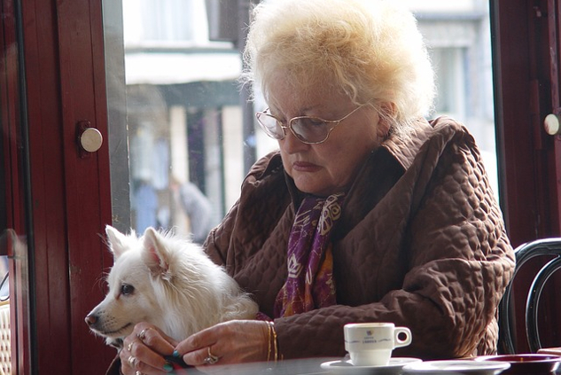 If You’re Feeling Guilt and/or Anger When Your Pet Dies an old woman holding a dog on her lap