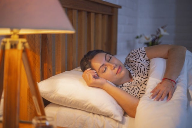 woman sleeping with a slight smile on her face