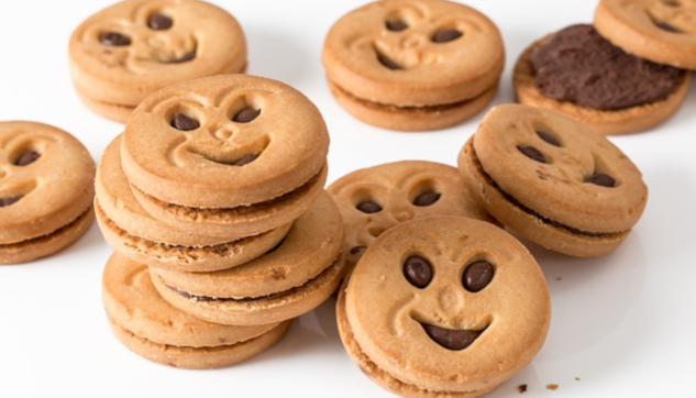 A bunch of smiling face sugar-dovered cookies. Image by Steve Buissinne from Pixabay.&nbsp;