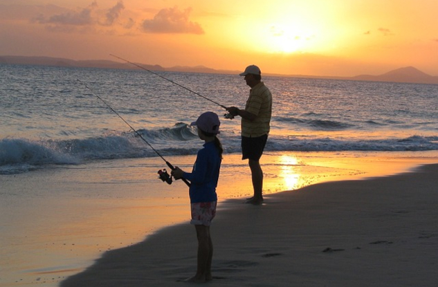 InnerSelf Magazine: February 3, 2025 father and son fishing on the shore at sunrise