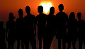 A group of people standing together in the light. Image by Enlightening Images from Pixabay.&nbsp;